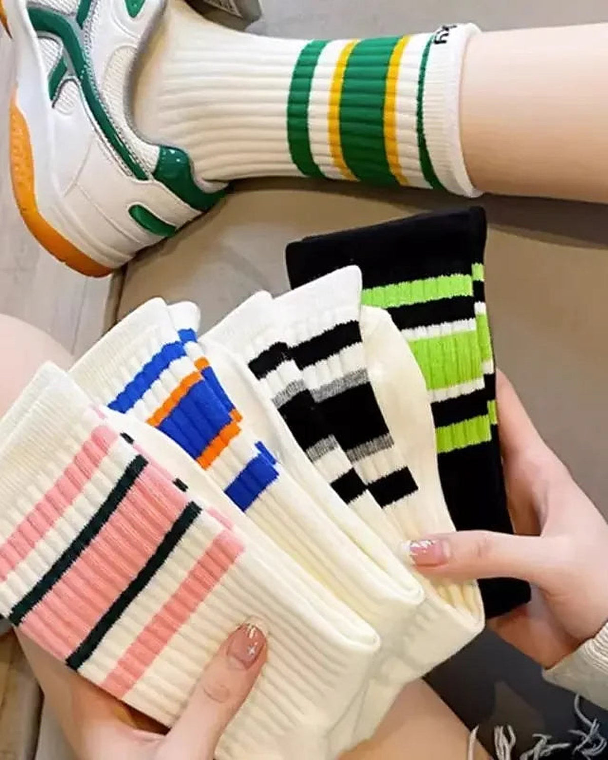 Striped sport crew socks worn with sneakers
