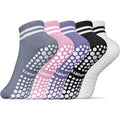 Pastel twin-stripe grip socks in blue grey, pink, purple and black, showing the grip soles